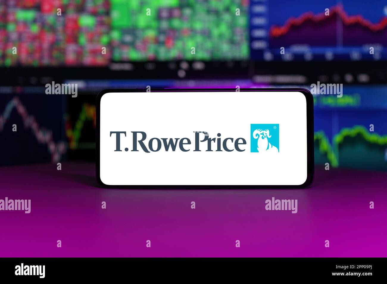 T. Rowe Price on stock market index in front of stock market charts ...
