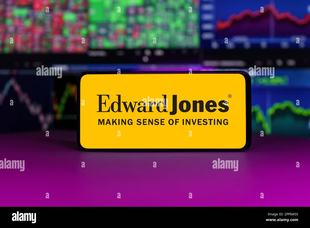 Edward Jones on stock market index in front of stock market charts