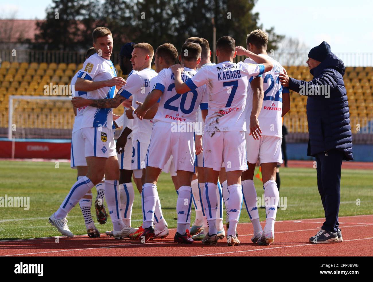 Uzhhorod, Ukraine - March 12, 2023: Dynamo Kyiv players and coach Mircea Lucescu celebrate after scored a goal during the VBET Ukrainian Premier League game against SC Dnipro-1 at Avanhard stadium Stock Photo