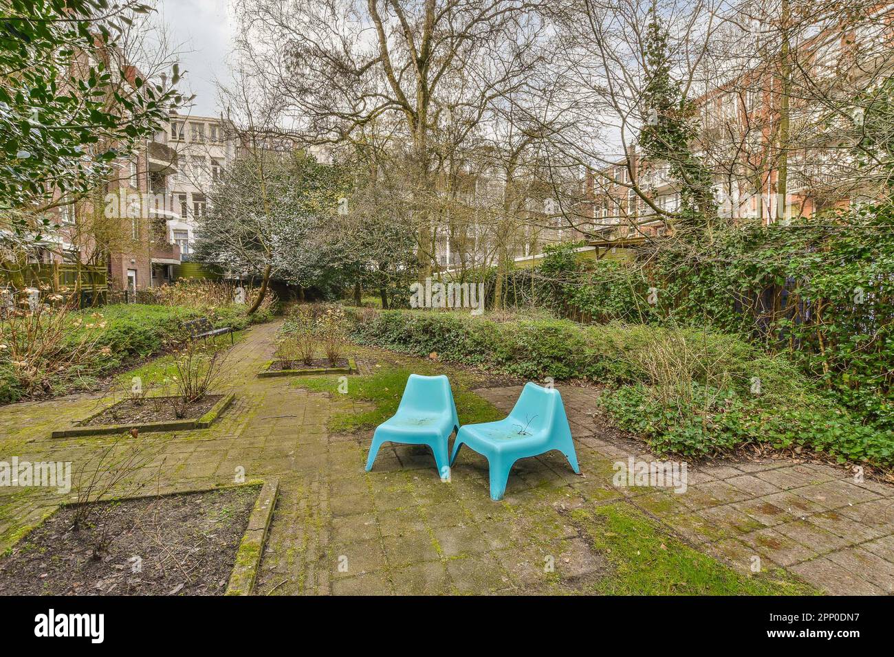 Autumn in a park with two garden chairs hi-res stock photography and ...