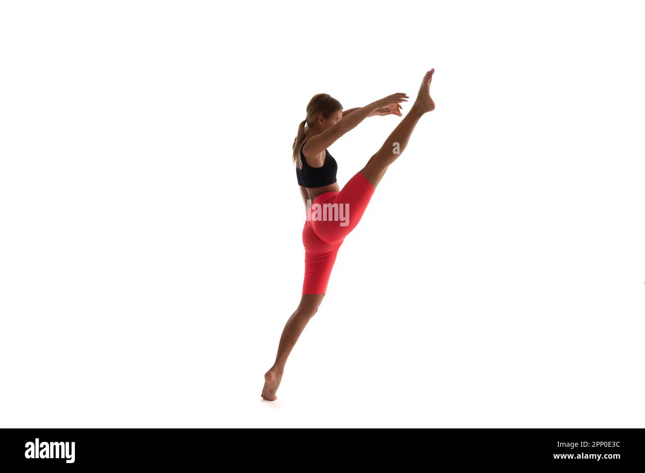 athlete sport woman do split on background. photo of sport woman do ...