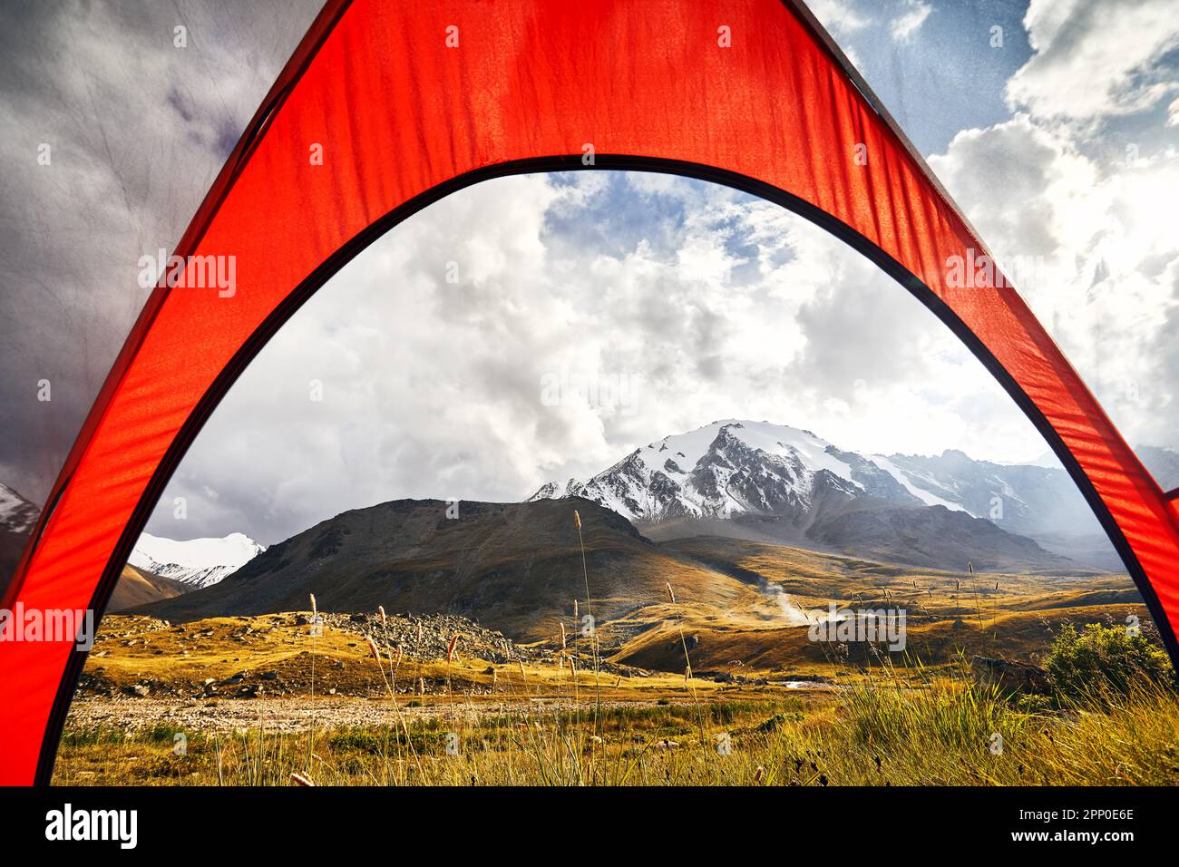 View from inside a tent of the mountains valley with glacier landscape concept of trekking in Central Asia Kazakhstan, Almaty Stock Photo