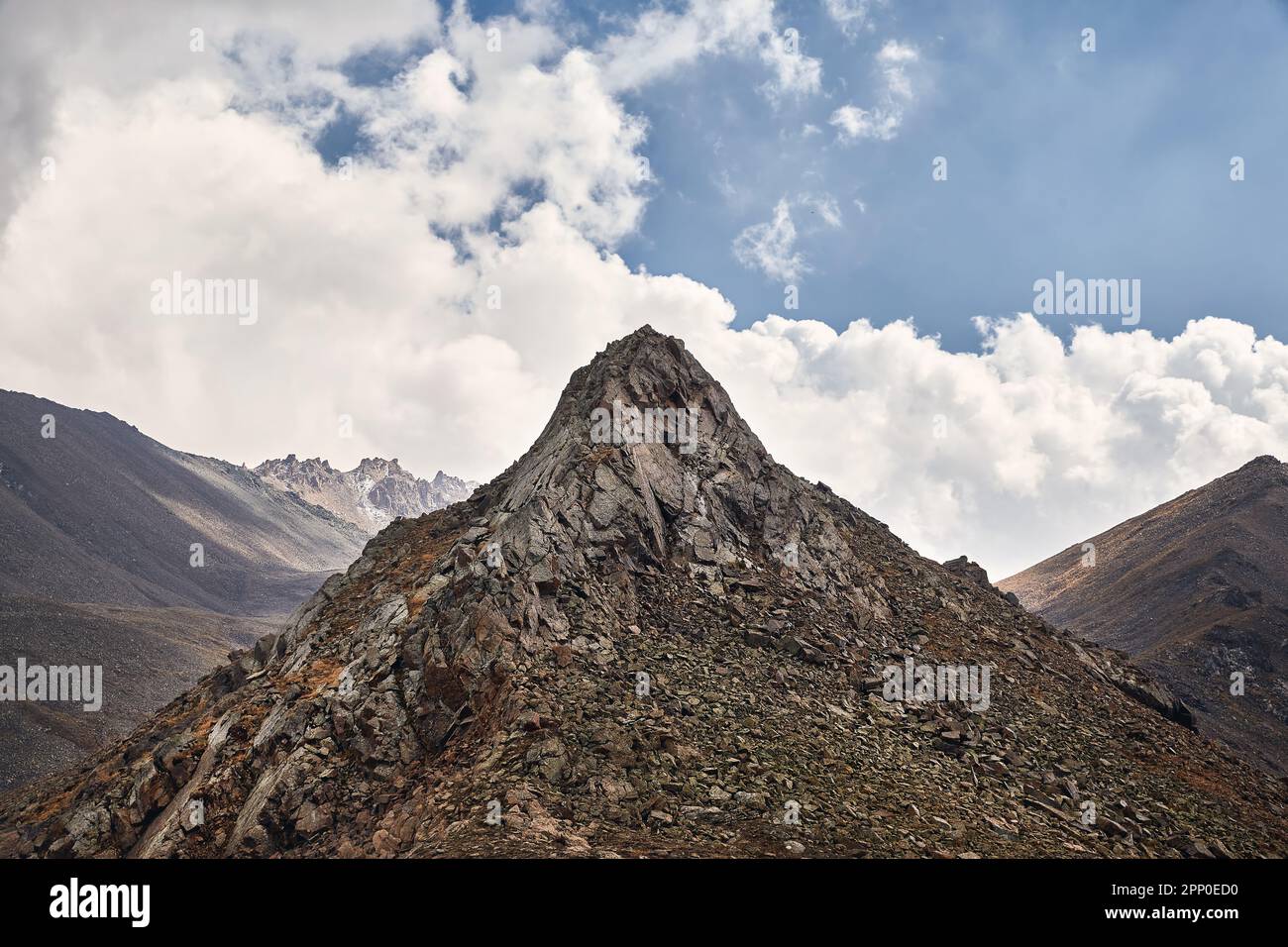 Mountain rock landscape valley against blue cloudy sky in Tien Shan Mountains in Almaty Kazakhstan Stock Photo