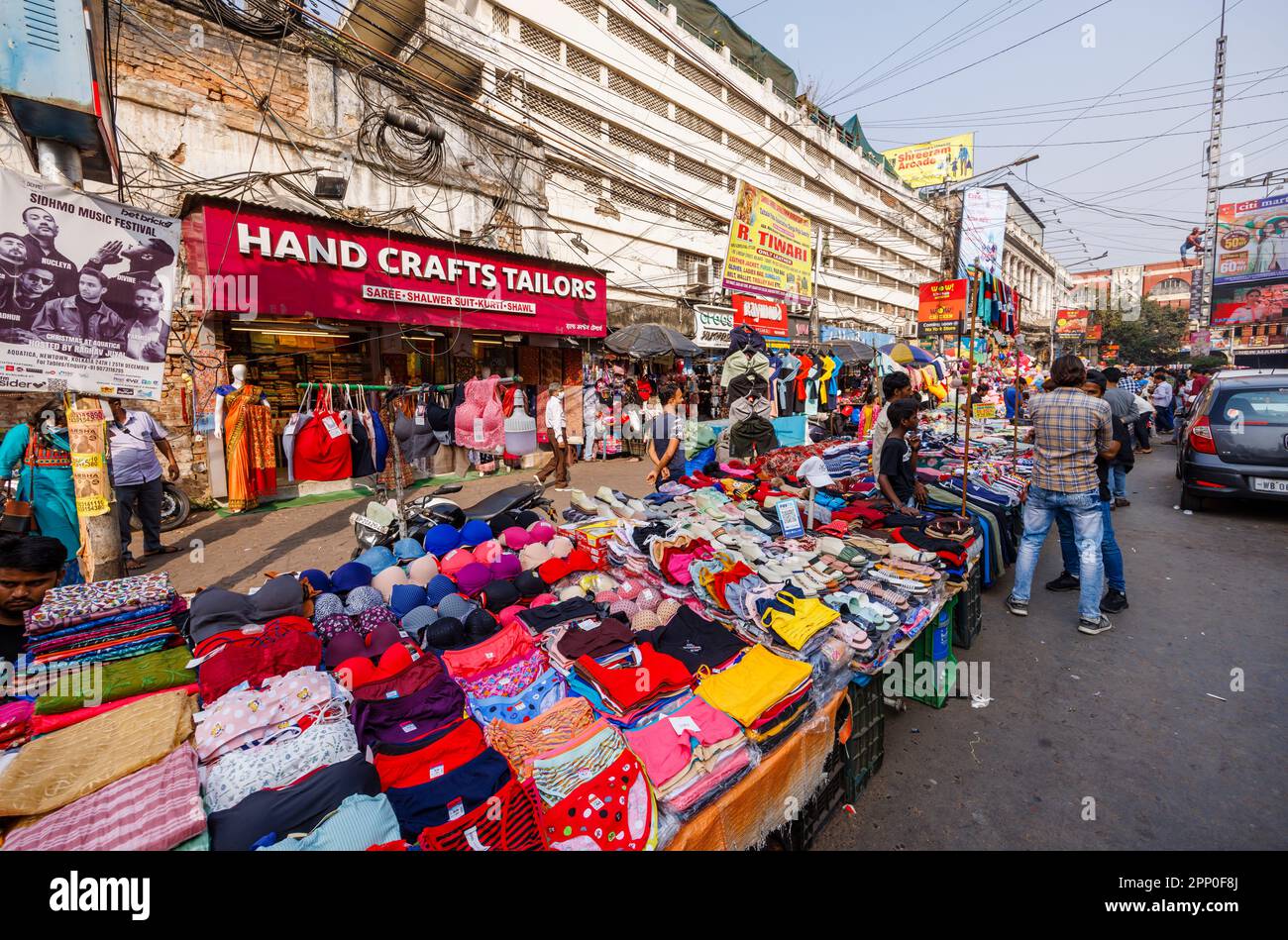 Stalls selling clothes and fabrics in the street in the New Market Area of Taltala, Kolkata (Calcutta), capital city of West Bengal, India Stock Photo