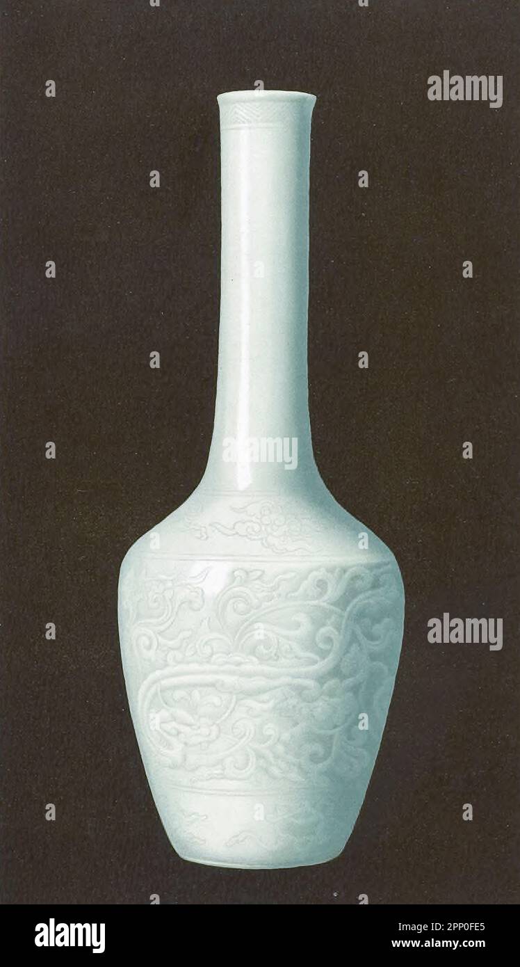 TRANSLUCENT WHITE Flower vase (Hua P'ing), of fine form and finished technique, with molded and chiseled designs invested with a white glaze of perfect purity and translucence K'ang-hsi period {1662-1722), From the book ' ORIENTAL CERAMIC ART COLLECTION OF William Thompson Walters ' Published in 1897 Stock Photo