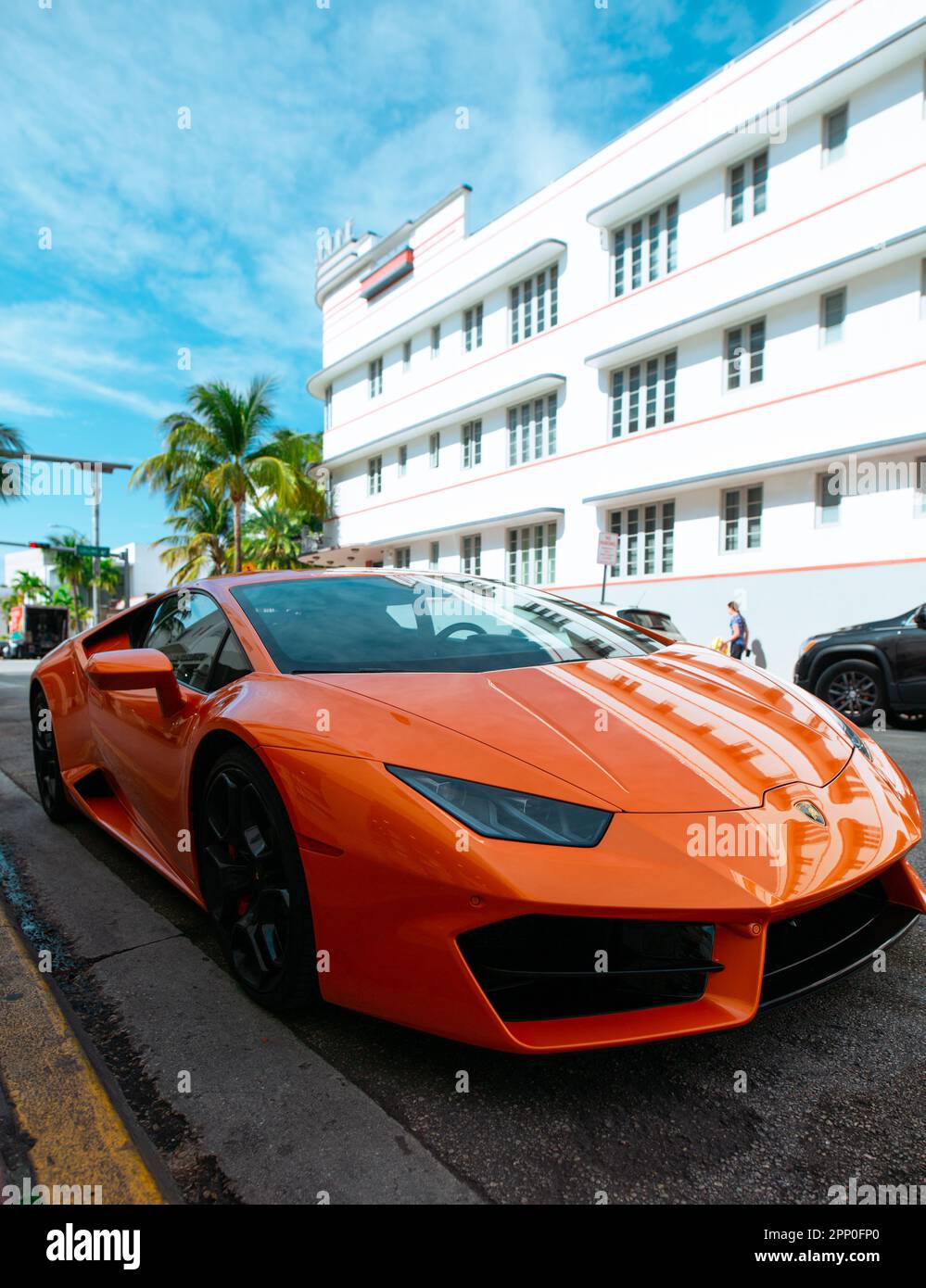 Orange Ferrari, with building reflection. South Beach Miami Stock Photo