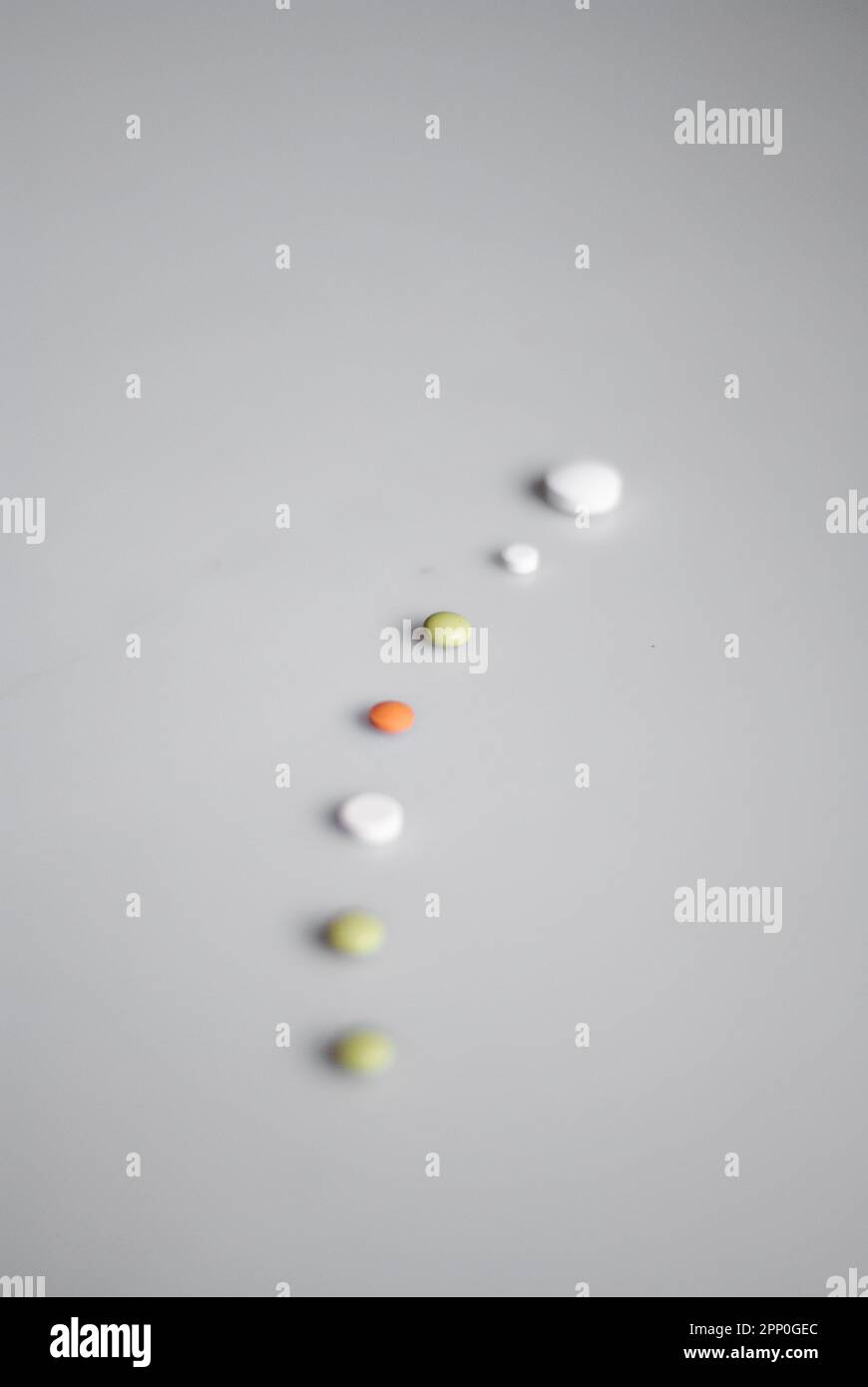 Close up of line of pills on the white background Stock Photo