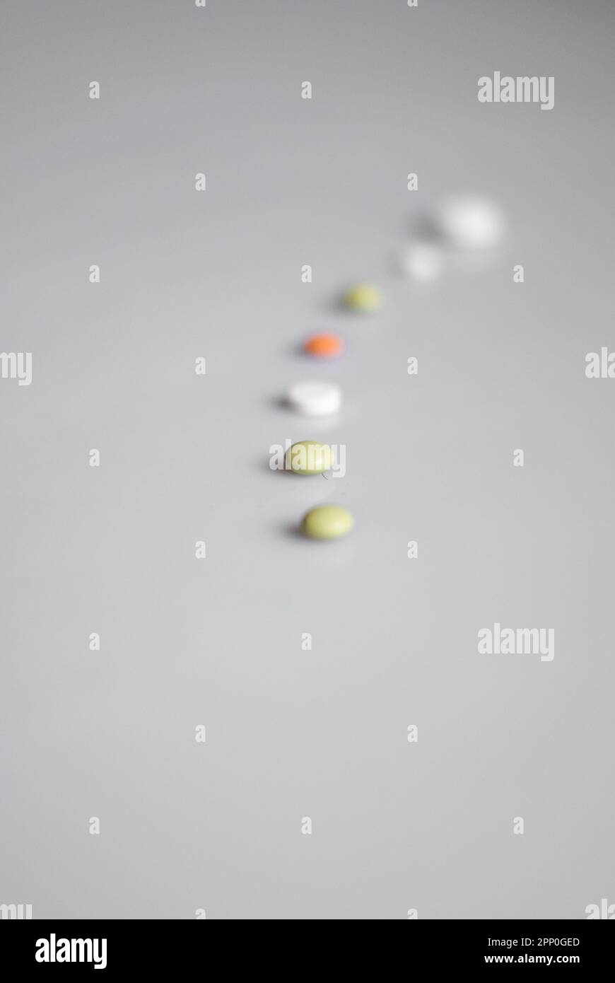 View on line of pills on the white background Stock Photo