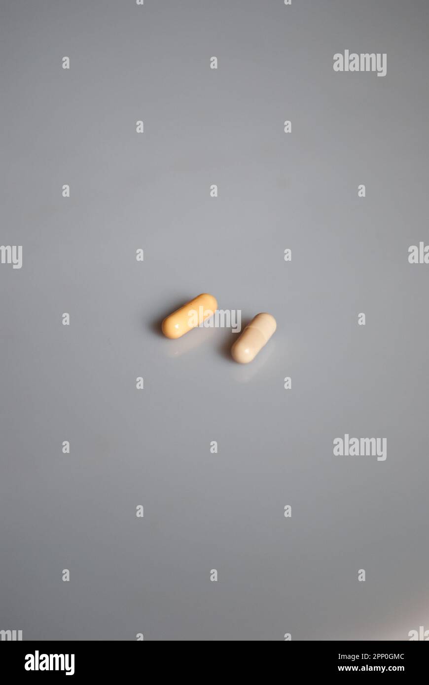 View on two pills on the white background Stock Photo
