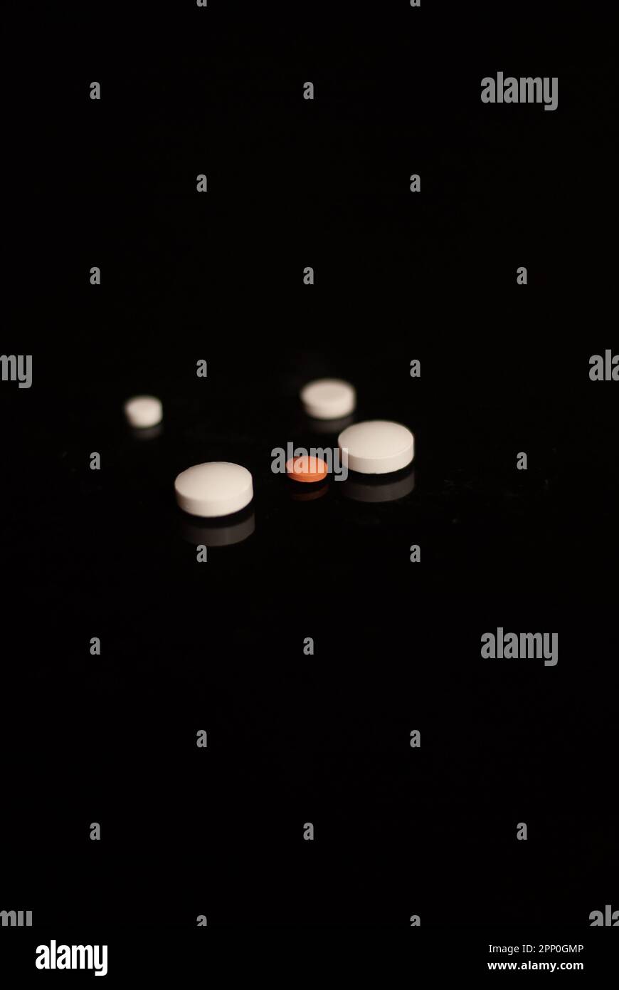 Close up of pills on the black background Stock Photo