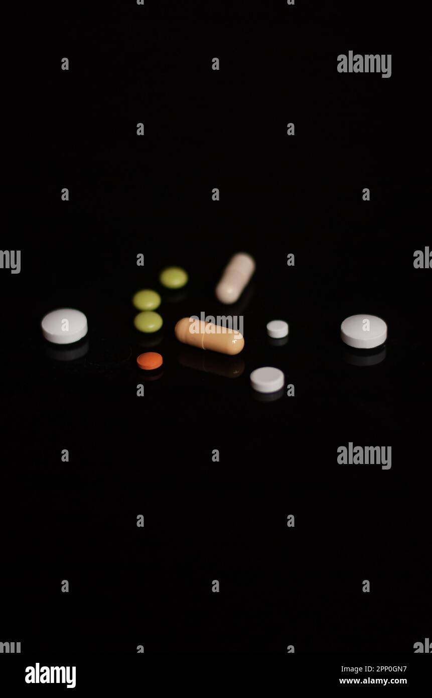 View on pills on the black background Stock Photo
