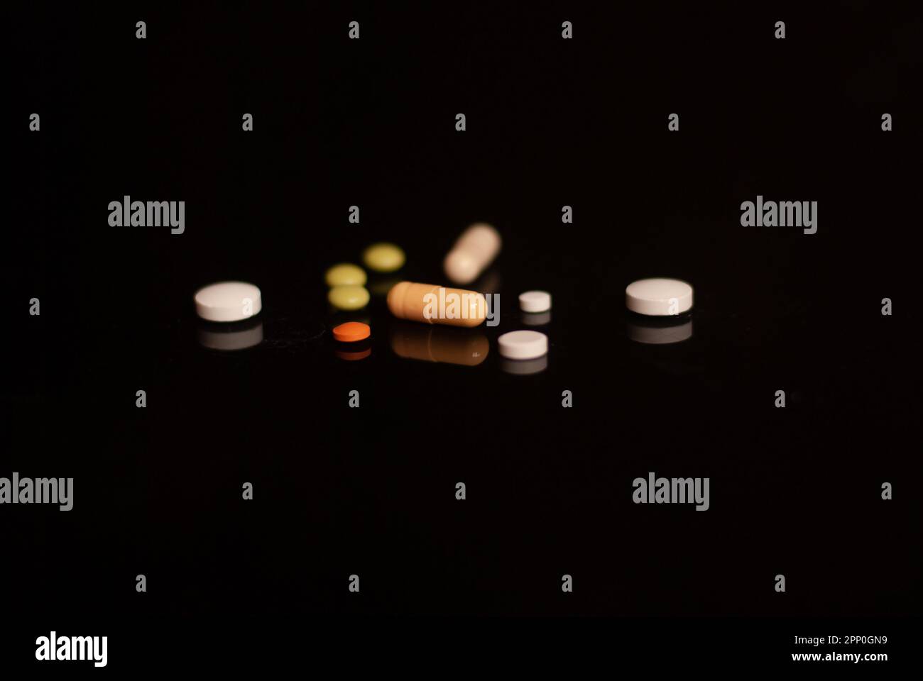 View of pills on the black background Stock Photo
