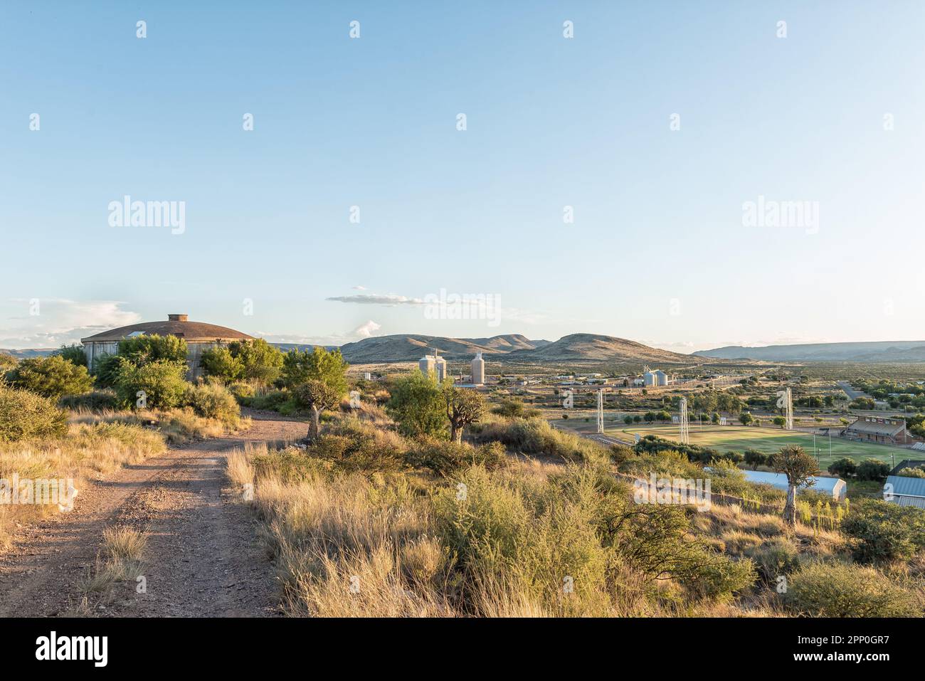 Prieska, South Africa - Feb 28 2023: Southern view from The Koppie Nature Reserve in Prieska. A reservoir, silos and sports field of the high school a Stock Photo