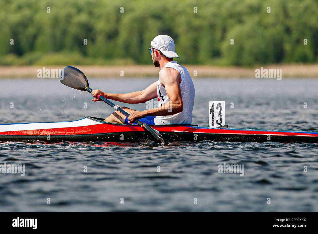 side view male kayaker athlete on kayak single in kayaking championship