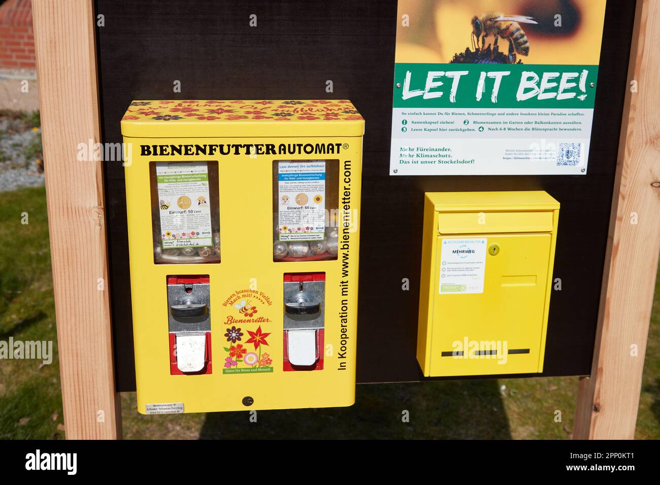 Stockelsdorf, Germany. 21st Apr, 2023. A yellow vending machine with the  inscription "Bienenfutter" (bee food) is located in Ahrensböker Straße  behind the town hall of Stockelsdorf. Bee food is now available from