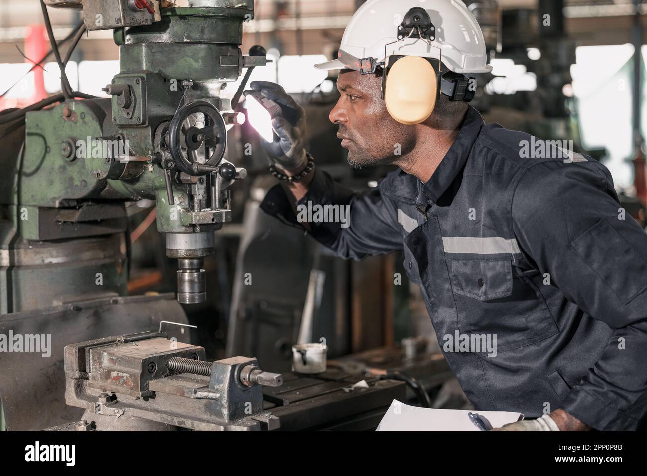 Skilled robotic technician spots the light on robotic components to do