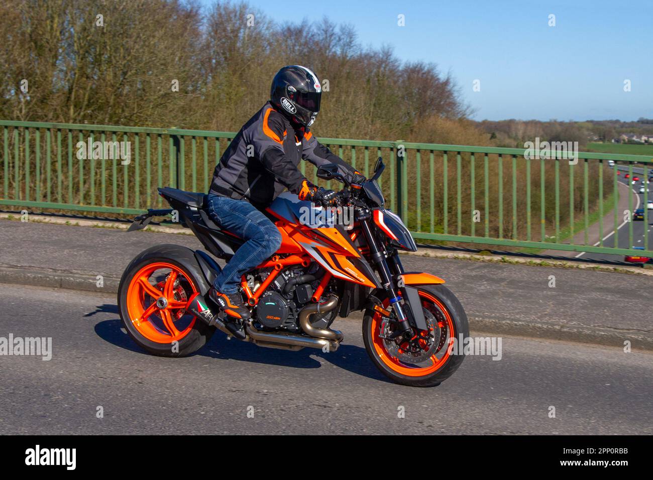 https://c8.alamy.com/comp/2PP0RBB/2023-ktm-1290-superduke-r-evo-22-v-twin-lc-4t-lc8-eu5-orange-motorcycle-sports-petrol-1301-cc-crossing-motorway-bridge-in-greater-manchester-uk-2PP0RBB.jpg