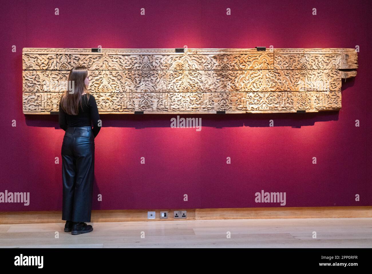 London UK. 21 April 2023. AN IMPORTANT ANDALUSIAN CARVED WOODEN FRIEZE ALMOHAD OR NASRID ANDALUSIA OR NORTH AFRICA, 12TH OR 13TH CENTURY, Estimate GBP 200,000 – GBP 300,000. Preview of Islamic and Indian Worlds including oriental rugs and carpets.  The sale takes place on 27 April at Christie's London . Credit: amer ghazzal/Alamy Live News Stock Photo