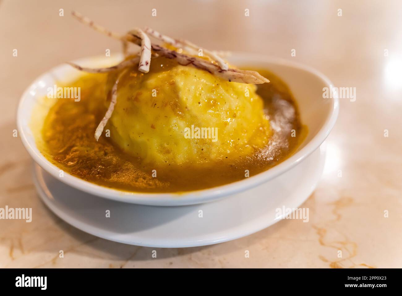 Cheesy mashed potato with deep fried yam strips. Stock Photo