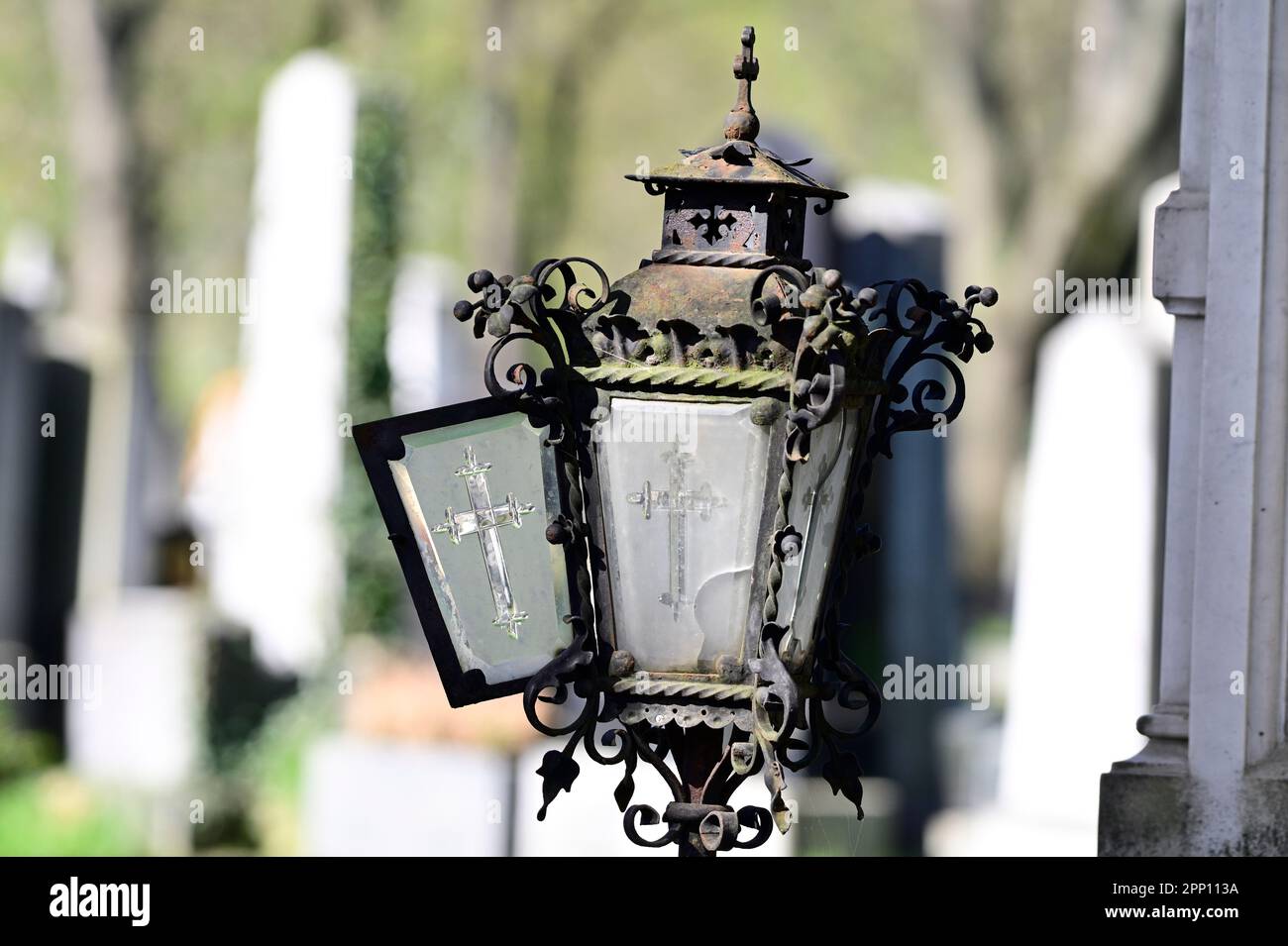Vienna, Austria. Vienna Central Cemetery. Old rusted grave lantern with a cross at the central cemetery Stock Photo