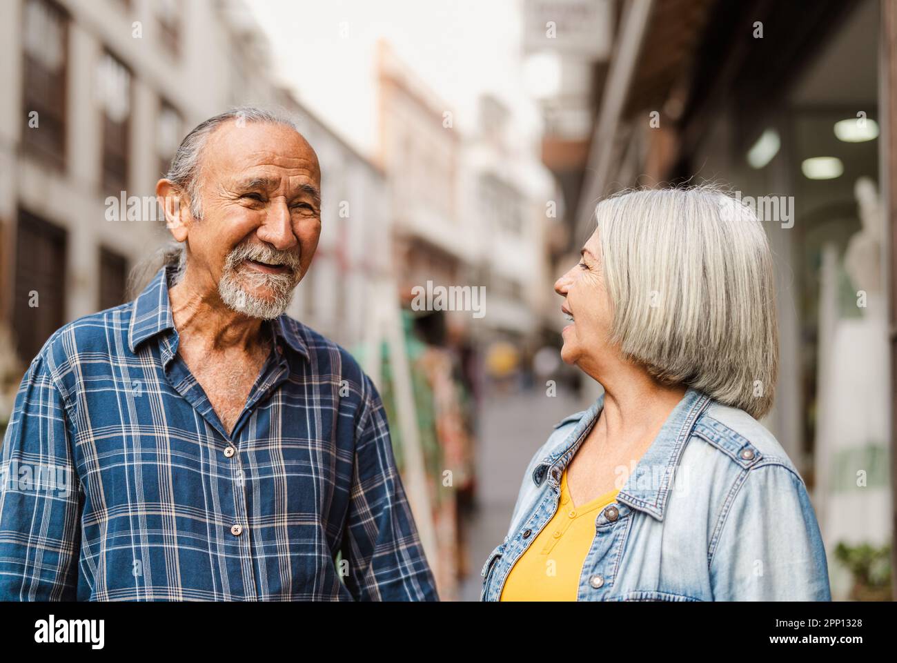 Happy senior couple having fun in city - Elderly people and love relationship concept Stock Photo
