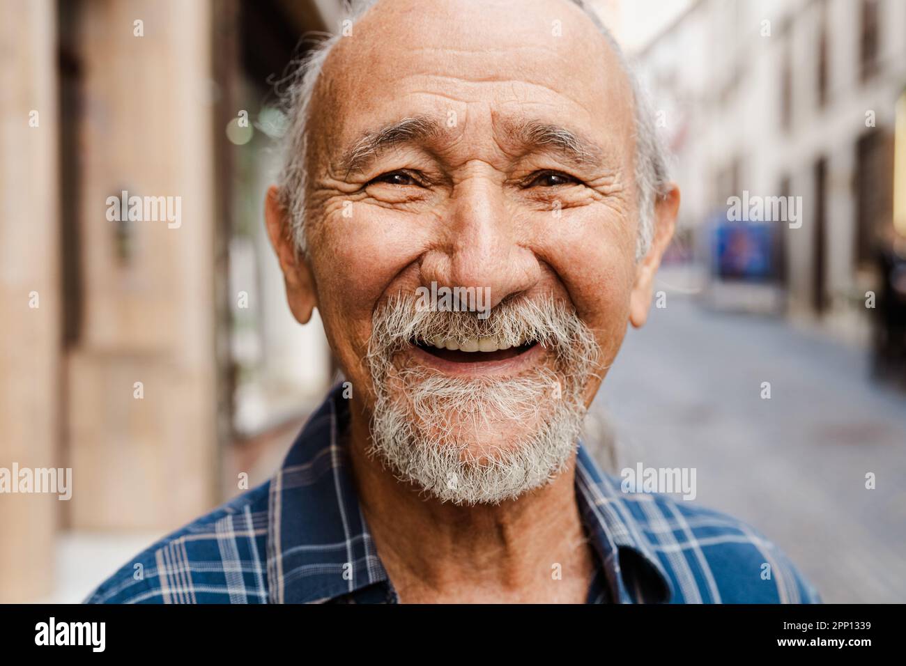 Portrait of happy senior man smiling in front of camera - Elderly people lifestyle concept Stock Photo