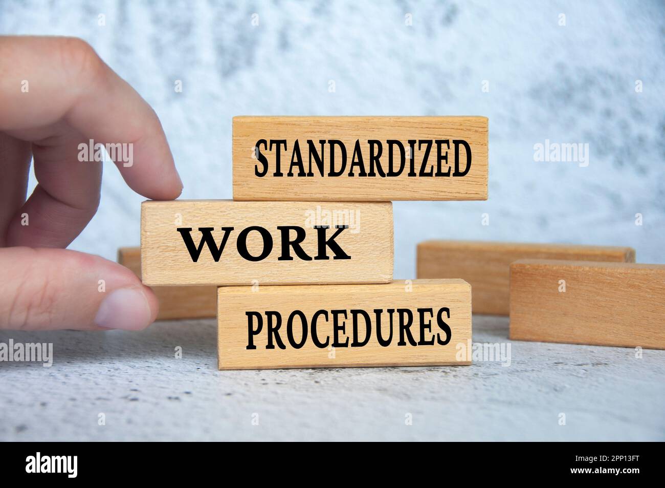 Standard work procedures text on wooden blocks. Business concept. Stock Photo