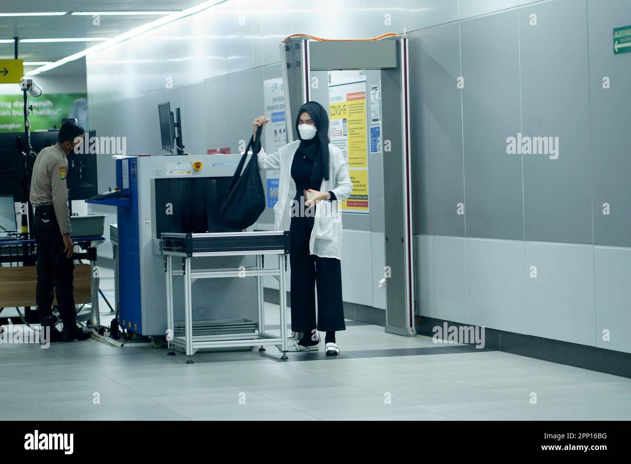 Security Check At MRT Station Jakarta Indonesia With Male Officer And   Security Check At Mrt Station Jakarta Indonesia With Male Officer And Female Passanger April 20 2023 Publice Service Photography 2PP16BG 