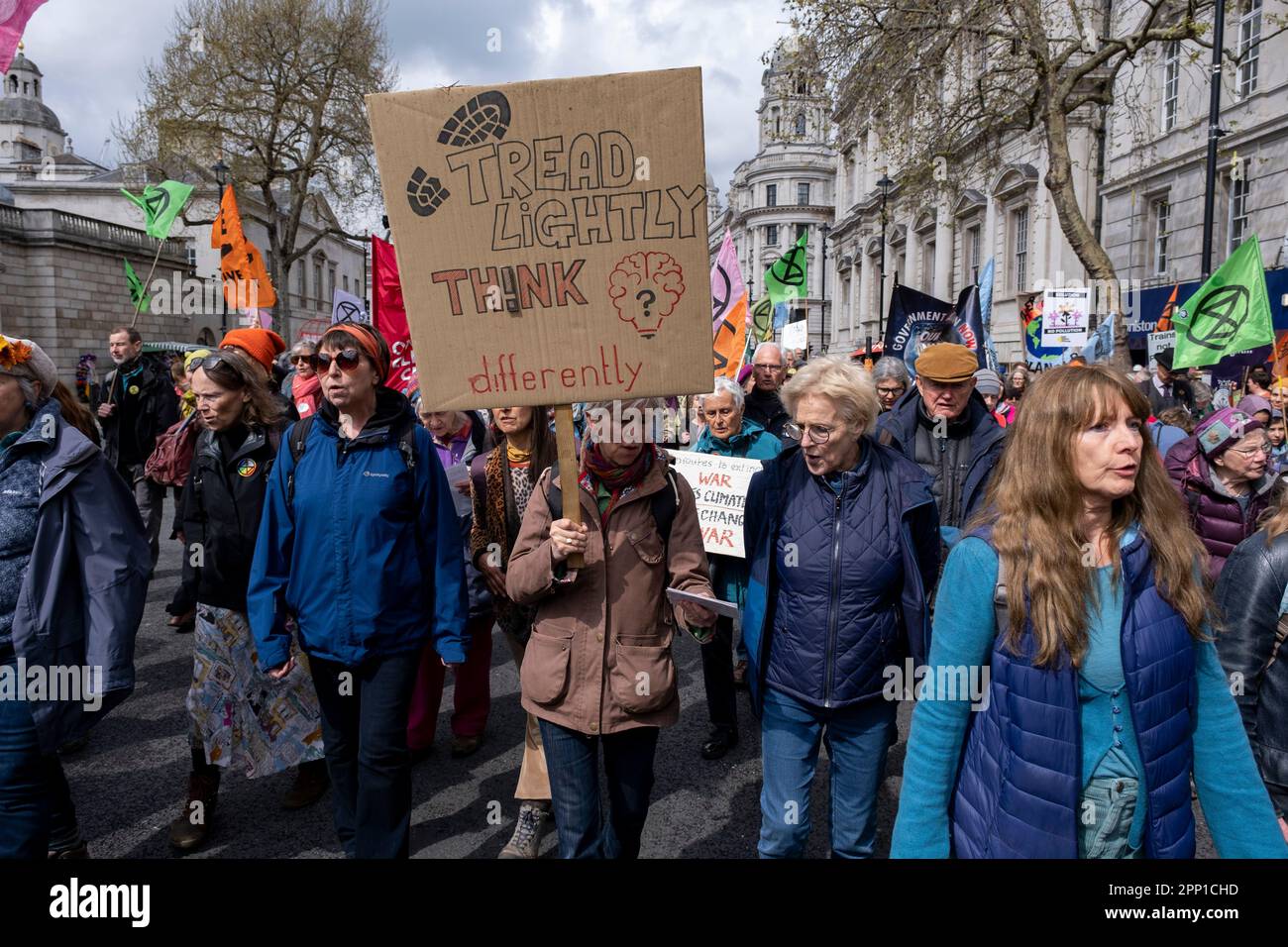 Thousands of protesters from various environmental groups including the Bristol Climate Choir, part of the Climate Choir Movement join together with Extinction Rebellion for their Unite to Survive day, part of ‘The Big One’  non-disruptive protest in Westminster on 21st April 2023 in London, United Kingdom. Extinction Rebellion is a climate change group started in 2018 and has gained a huge following of people committed to peaceful protests. These protests are highlighting that the government is not doing enough to avoid catastrophic climate change and to demand the government take radical act Stock Photo