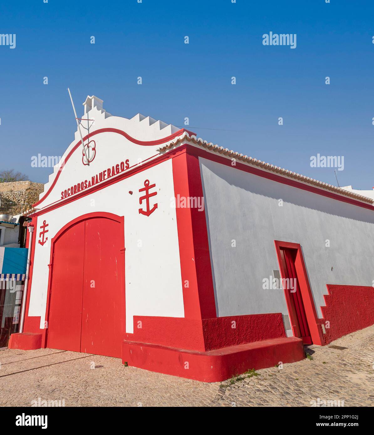 ALVOR, PORTUGAL - 16th APRIL, 2023: Restored old lifeguard station building dating from the 1920s in the town of Alvor. Stock Photo