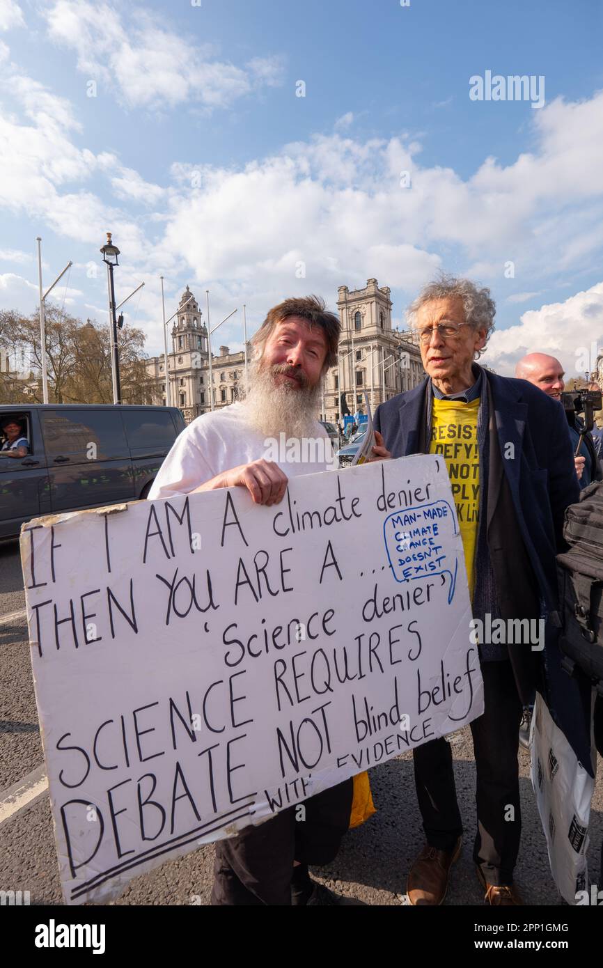 London, UK. 21st Apr 2023. Piers Corbyn ( brother of ex Labour party leader Jeremy) at Extinction Rebellion, The Big one, with a poster doubting climate change Parliament London United KIngdom Picture garyroberts/worldwidefeatures.com Credit: GaryRobertsphotography/Alamy Live News Stock Photo