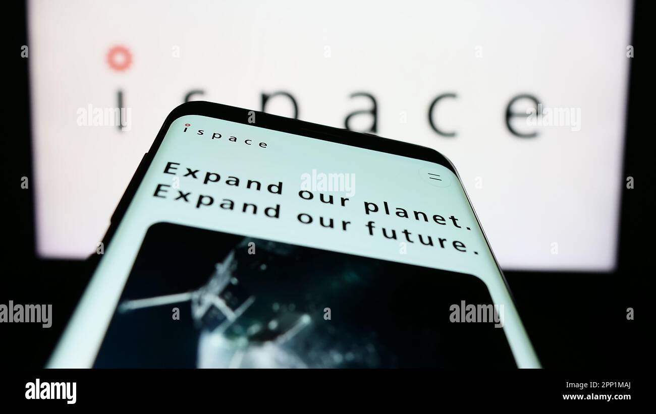 Mobile phone with website of Japanese aerospace company ispace Inc. on screen in front of business logo. Focus on top-left of phone display. Stock Photo