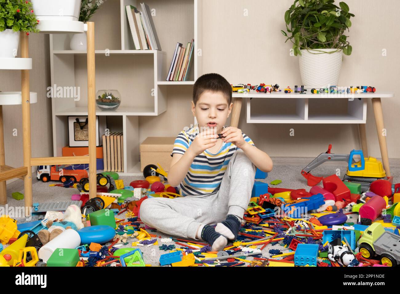 Little Boy Playing with Color Toys on Floor Stock Photo - Image of  bulldozer, little: 19039326