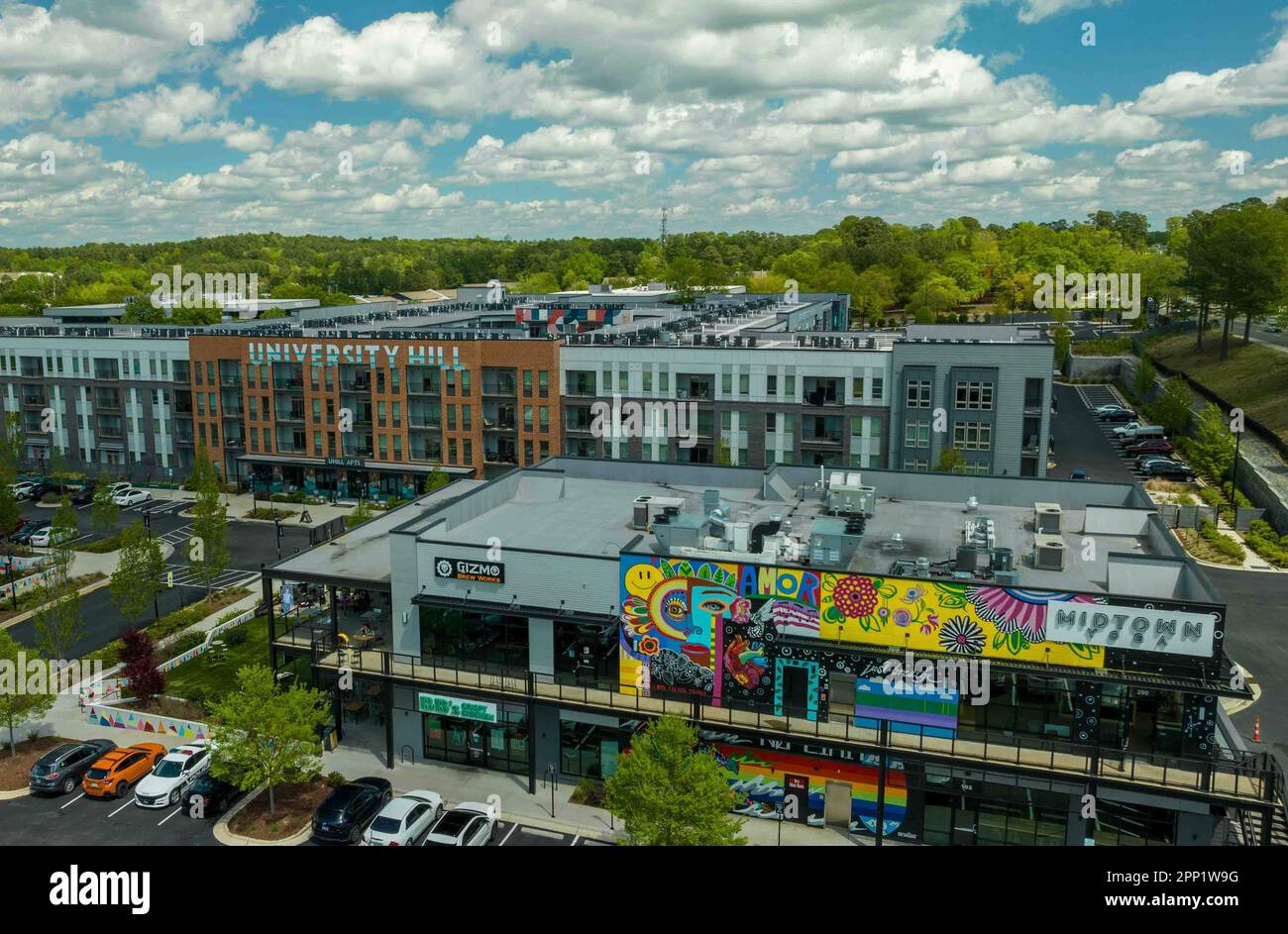 An aerial view of cars parked in front of University Hill in Syracuse