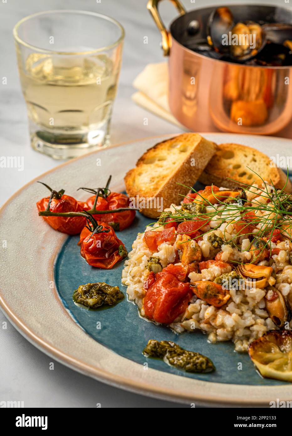Muscles Risotto Mussels risotto with garlic and tomatoes. Above shot Stock Photo - Alamy