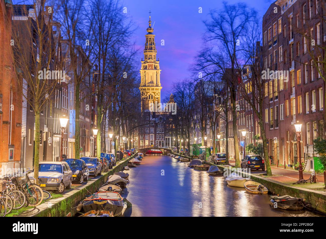 Amsterdam, Netherlands cityscape on the canals at twilight with Zuiderkerk Church. Stock Photo