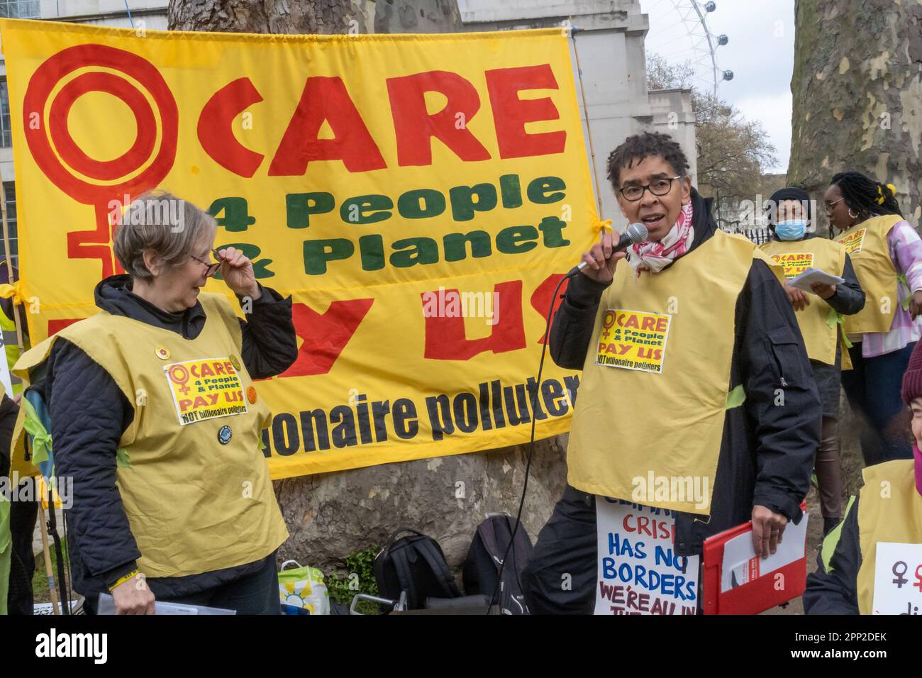 London, UK. 21 Apr 2023. On the first day of Extinction Rebellion's 'The Big One' women hold an open speakout opposite Downing St with the banner 'Care 4 People & Planet - Pay US NOT billionaire polluters''.. Women are being targeted by government cuts in mothers and disabled benefits to force them back into employment while they support fossil fuel polluters and other destructive industries. Young people and women have been at the forefront of the movement for climate justice around the world. Peter Marshall/Alamy Live News Stock Photo