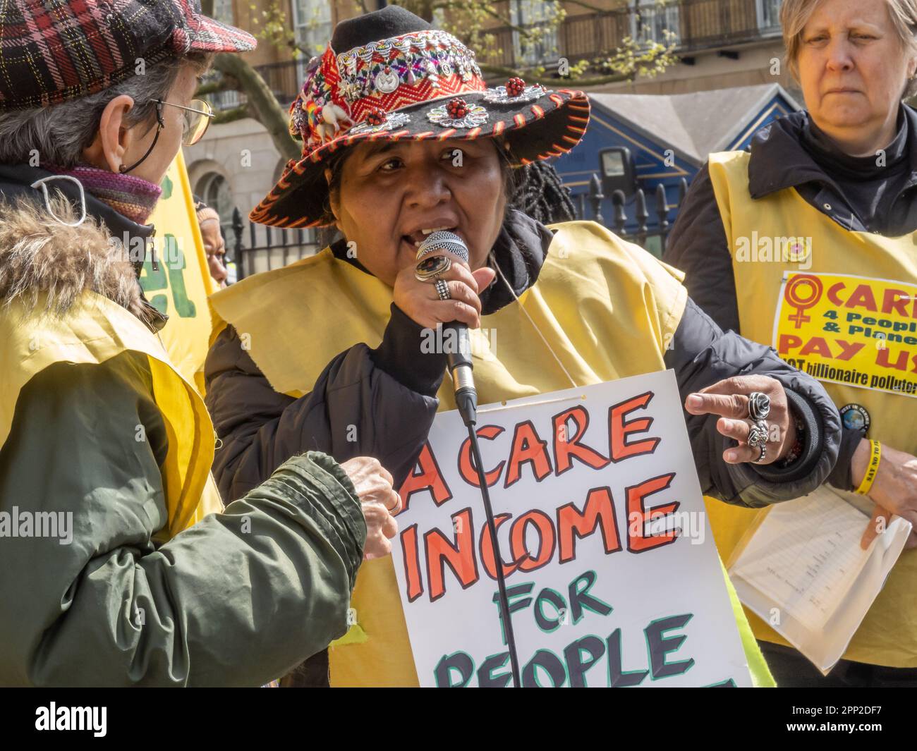 London, UK. 21 Apr 2023.  A leading indigenouus feminist from Peru talks about the state of her country.On the first day of Extinction Rebellion's 'The Big One' women hold an open speakout opposite Downing St with the banner 'Care 4 People & Planet - Pay US NOT billionaire polluters''.. Women are being targeted by government cuts in mothers and disabled benefits to force them back into employment while they support fossil fuel polluters and other destructive industries. Young people and women have been at the forefront of the movement for climate justice around the world. Peter Marshall/Alamy Stock Photo