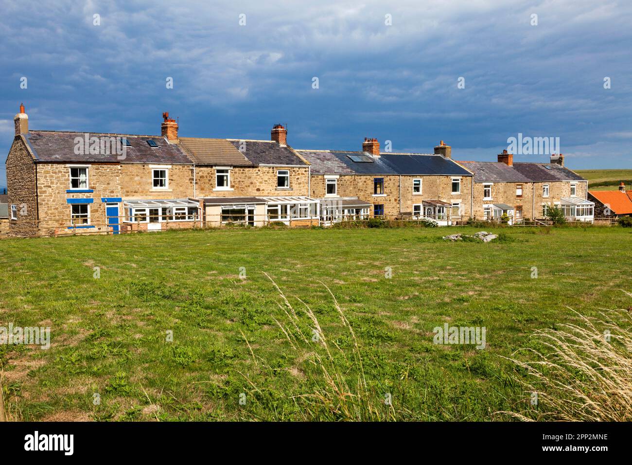 Rural cottages overlooking agricultural land in the U.K. Stock Photo