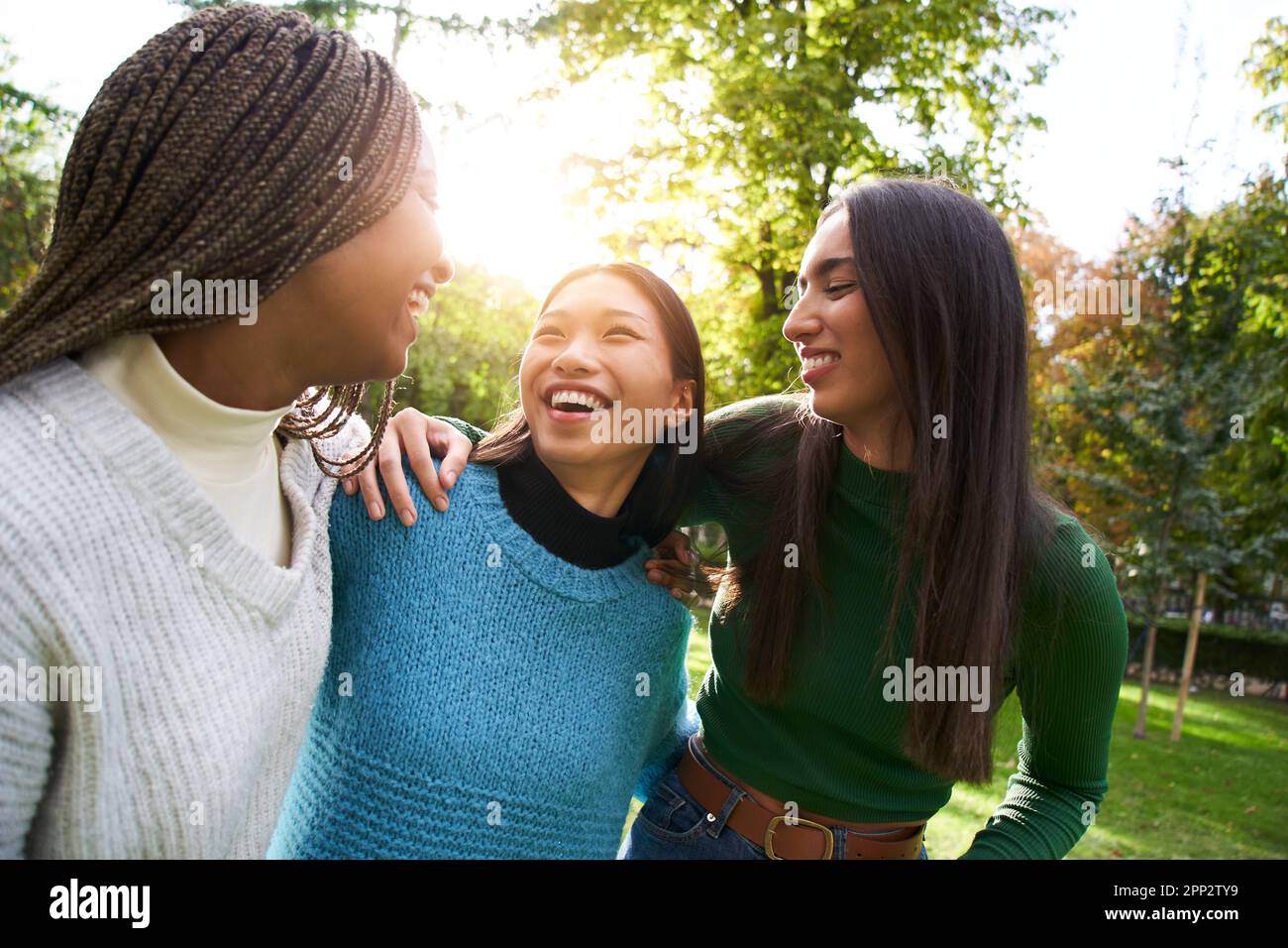Portrait of three girls having fun outdoors on a sunny spring day. People enjoying their free time. Stock Photo