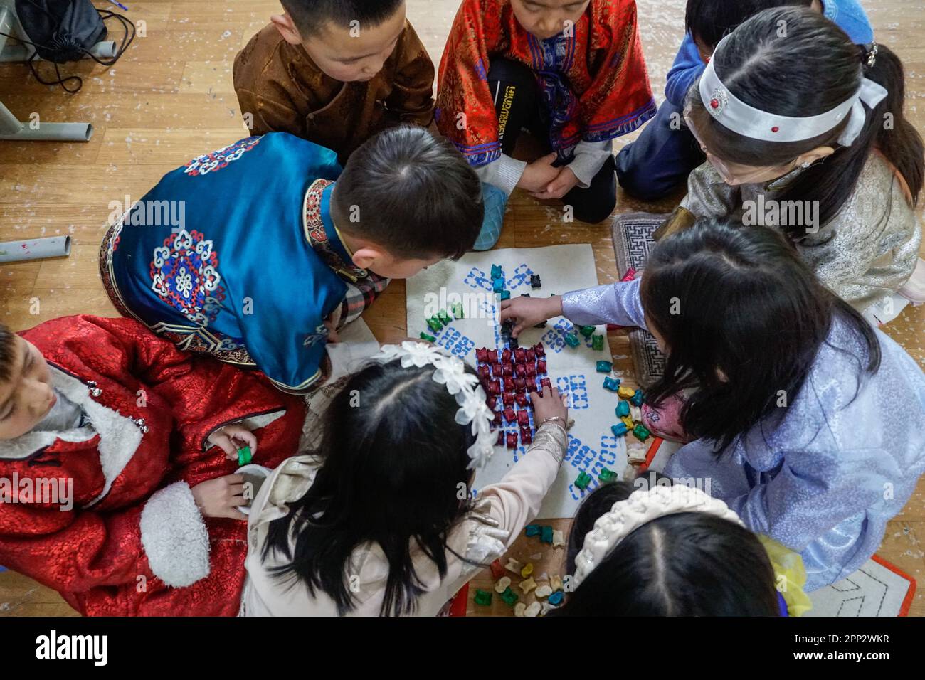 second-graders-play-a-traditional-anklebone-game-in-dalanzadgad