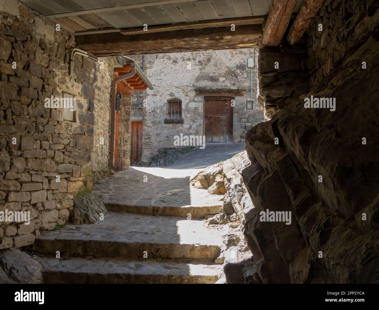 cobblestone alley of a typical Pyrenean village, medieval stone buildings, Torla, Huesca, Aragon, Spain, horizontal Stock Photo