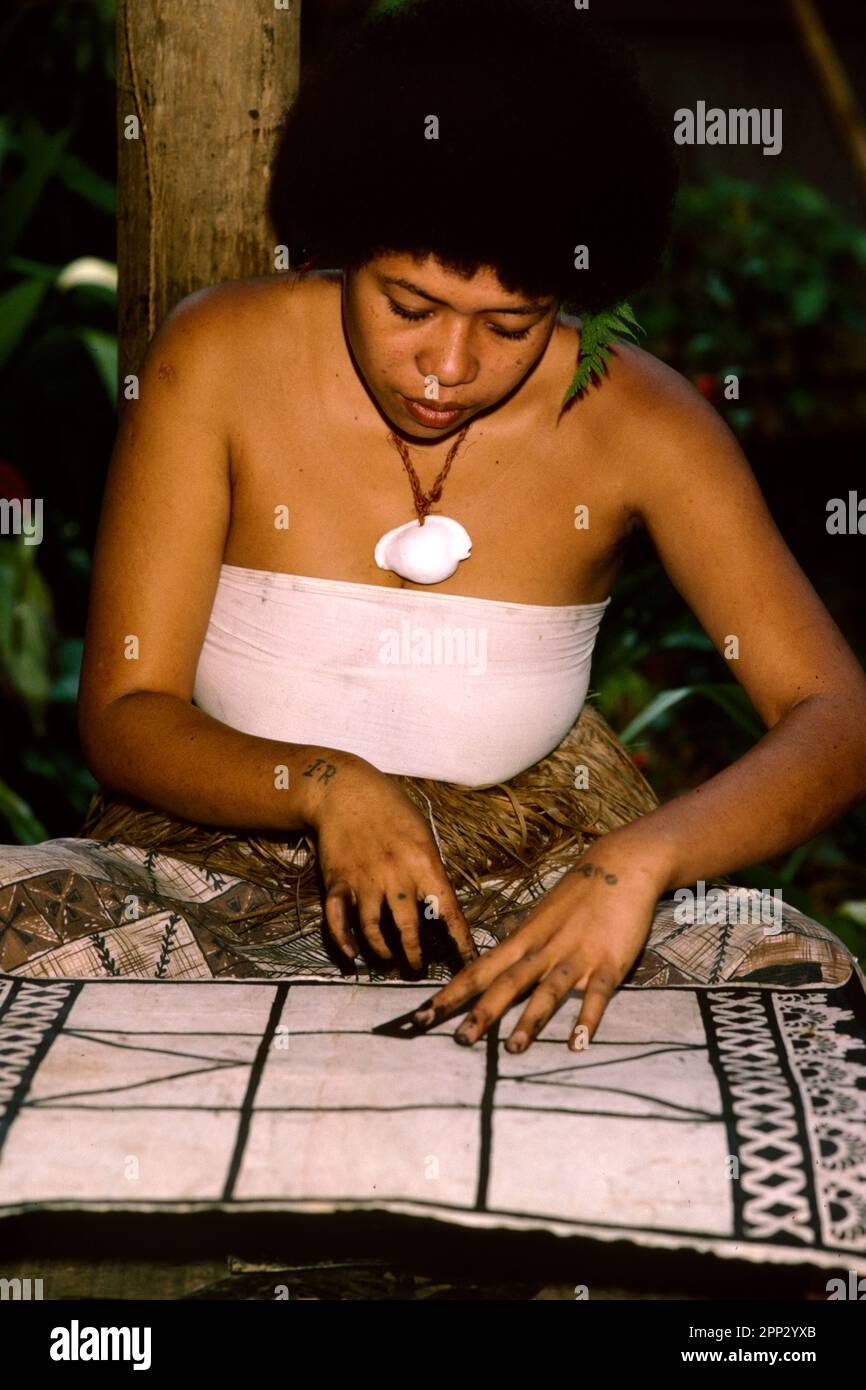 Woman applying design to tapa cloth, Pacific Harbour Cultural Centre, Viti Levu, Fiji Stock Photo