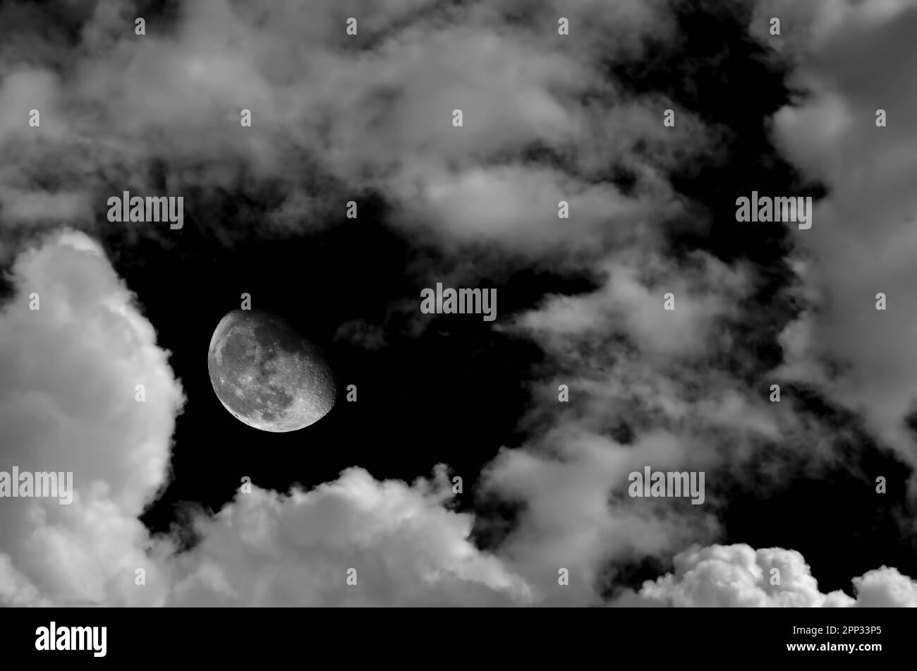 Monochrome image of moon and clouds at night Stock Photo - Alamy