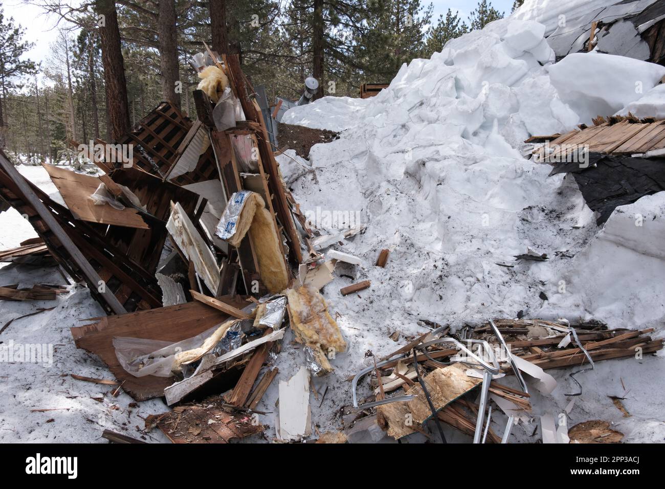 Mammoth Lakes, CA. April 21, 2023. A collapsed structure destroyed by a