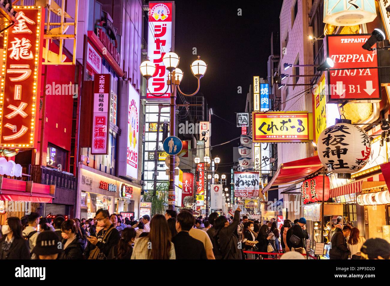 Osaka nightlife April 2023, crowds in Dotonbori district after sunset, with famous neon illuminated streets of Osaka, Japan, spring evening,Asia Stock Photo