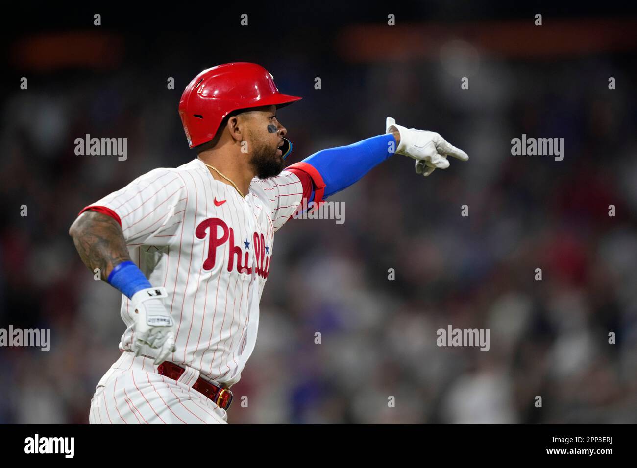 Edmundo Sosa #33 of the Philadelphia Phillies reacts after hitting a solo  home run during the eighth inning.