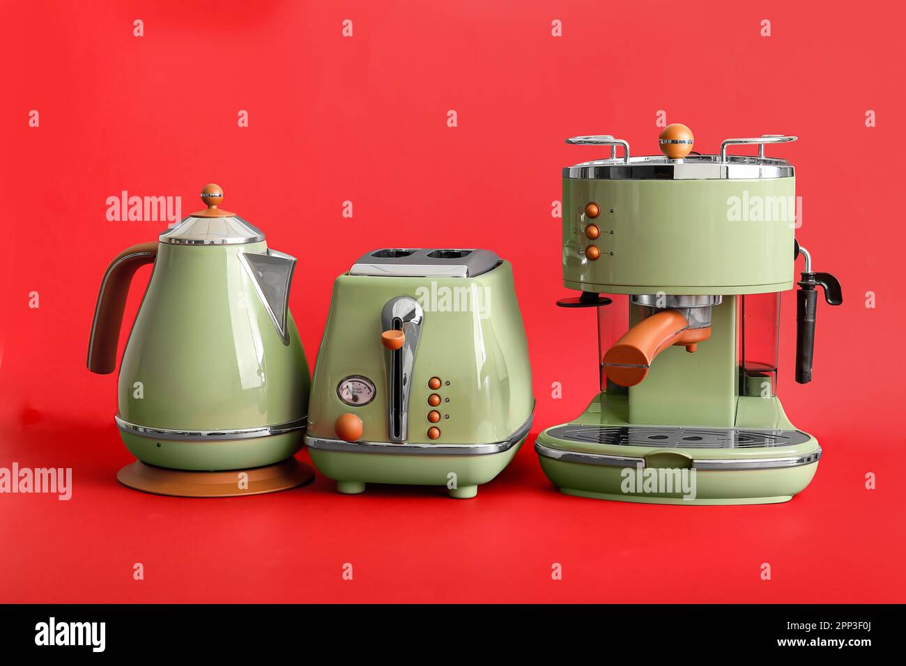 https://c8.alamy.com/comp/2PP3F0J/electric-kettle-toaster-and-coffee-machine-on-red-background-2PP3F0J.jpg