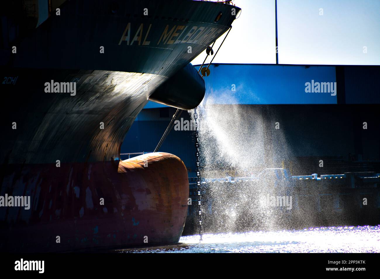 Closeup Front of Bulk Carrier with water spraying out in afternoon sunlight in Port Melbourne, Victoria, Australia Stock Photo