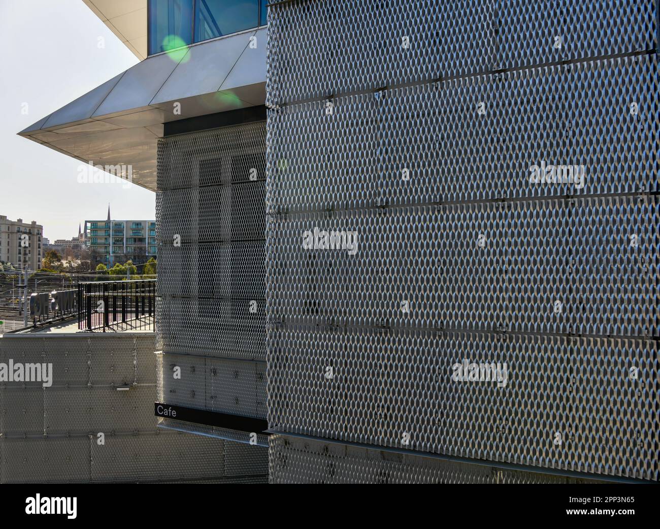 Architectural Design Metal Perforated Facade Fabric attached to Office Building in City Stock Photo